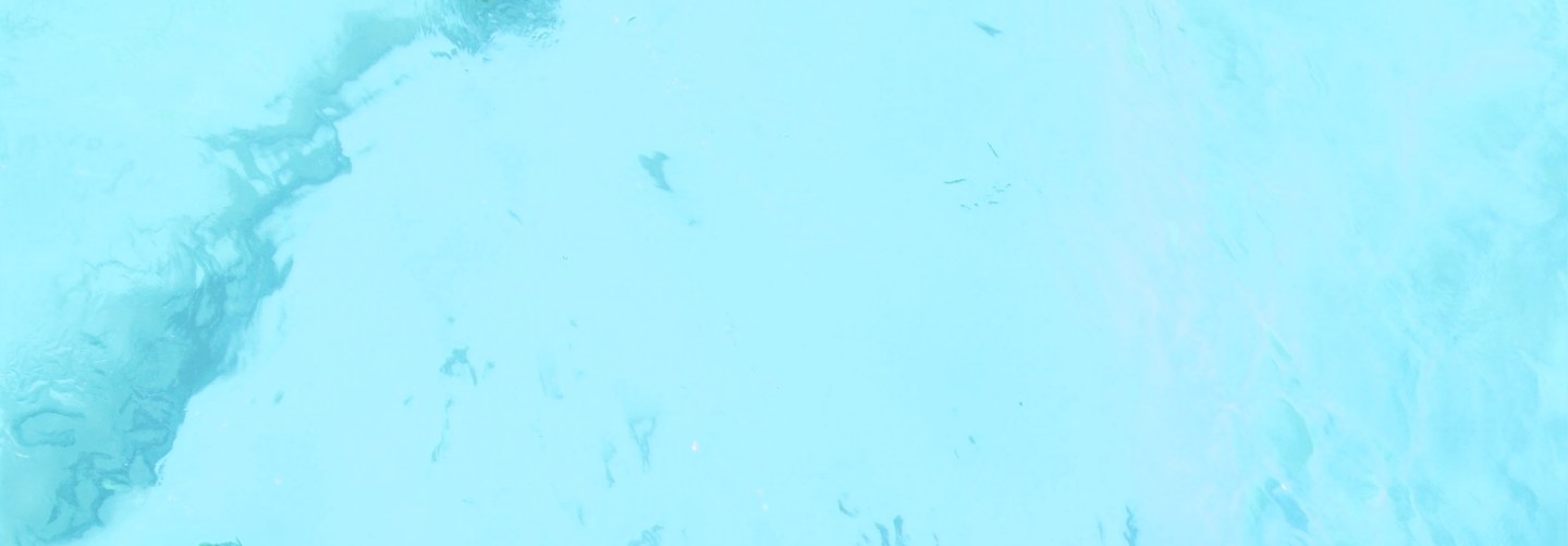 Sunlit turquoise river water
